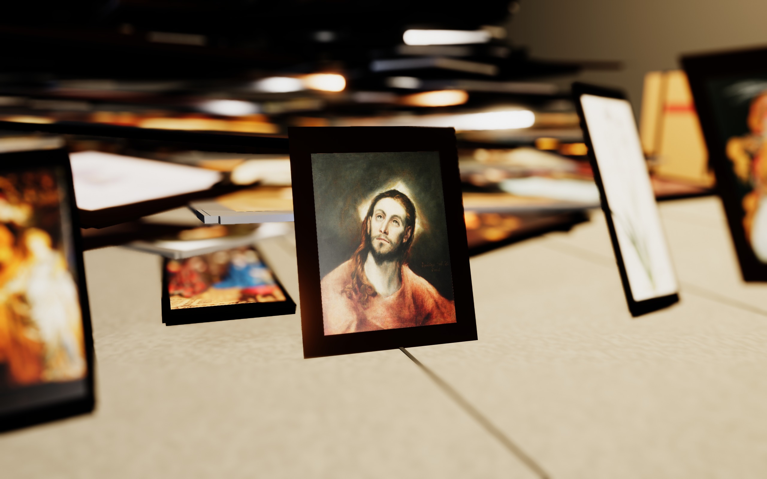 A small framed portrait in sharp focus against a heavily blurred mountain of paintings.
