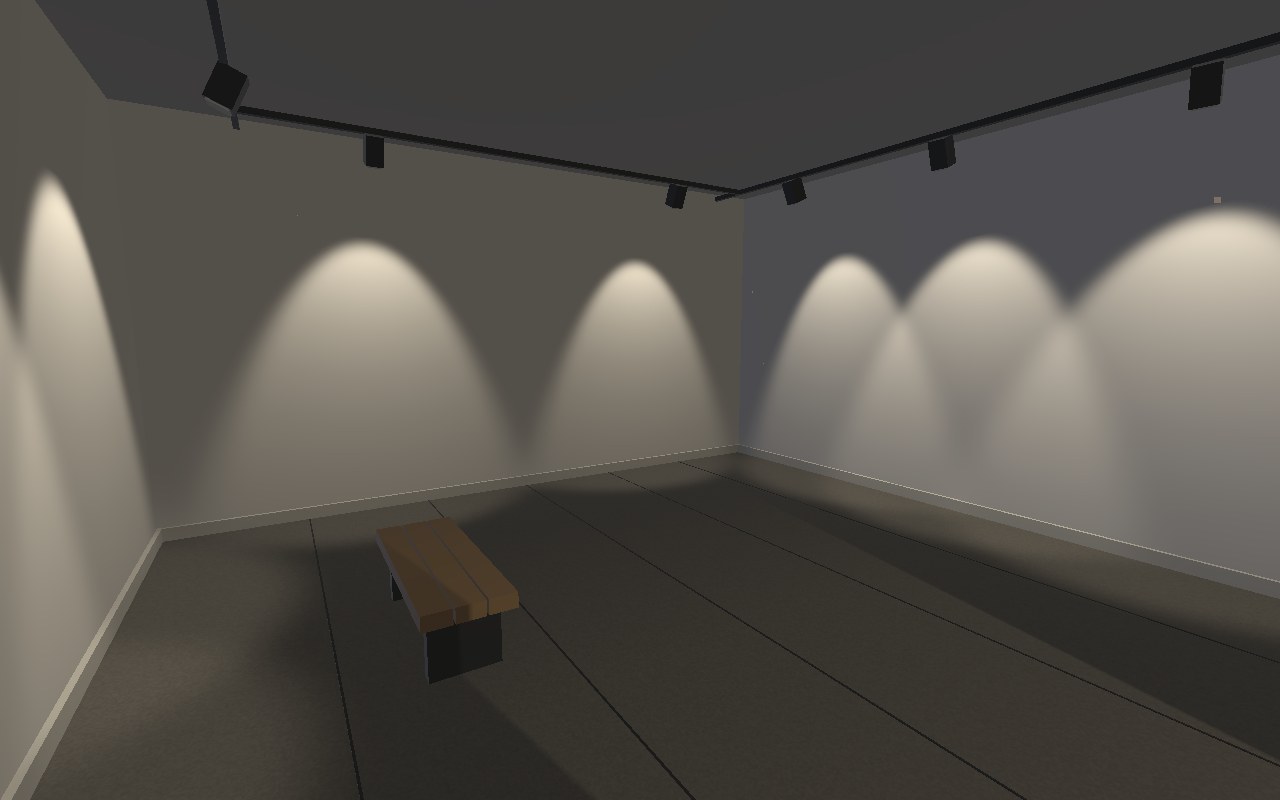 An empty gallery with concrete flooring, a wooden bench, and pools of light on the walls.